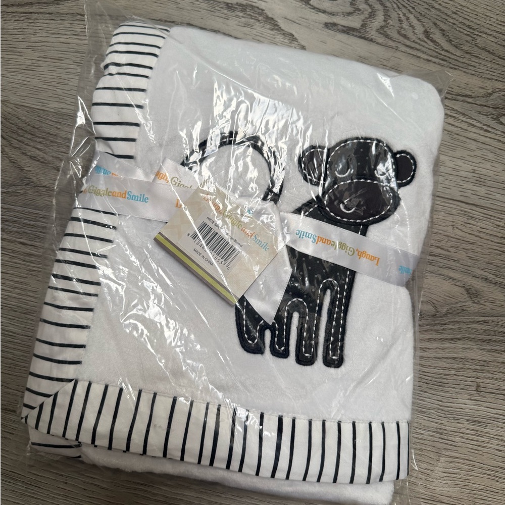 White and Black Striped Baby Blanket with Monkey Design